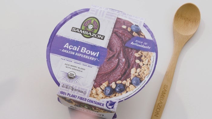 sambazon acai bowl sitting on the counter next to a spoon