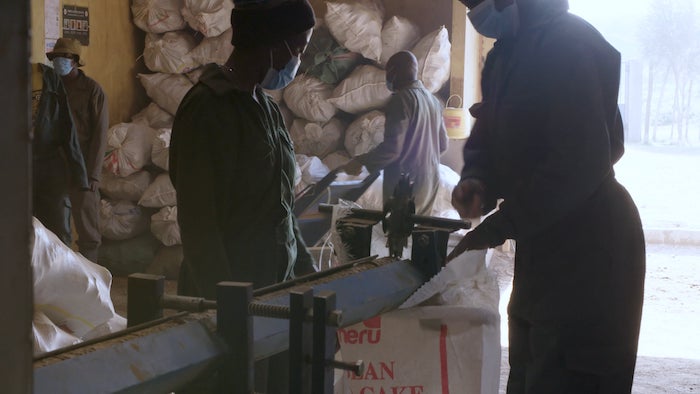 workers manning a station at a waste-to-value sanitation plant in east africa