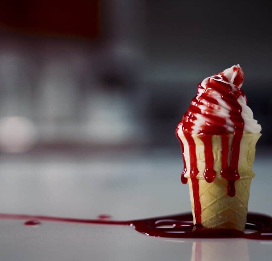 ice cream cone dripping blood to refer to consumer fraud in humane dairy